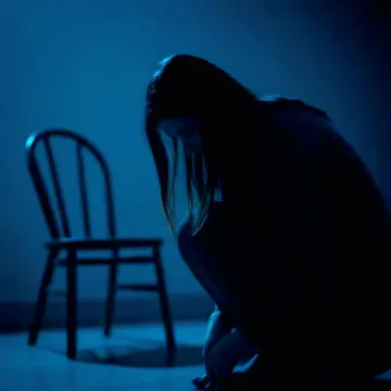 silhouette-woman-crouching-dark-sadness